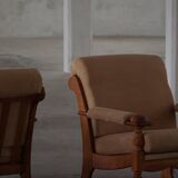 Mid-20th century, pair of armchairs by Henning Kjærnulf, oak and alcantara, 1960s.