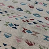 White margoum carpet with multicolored Berber patterns