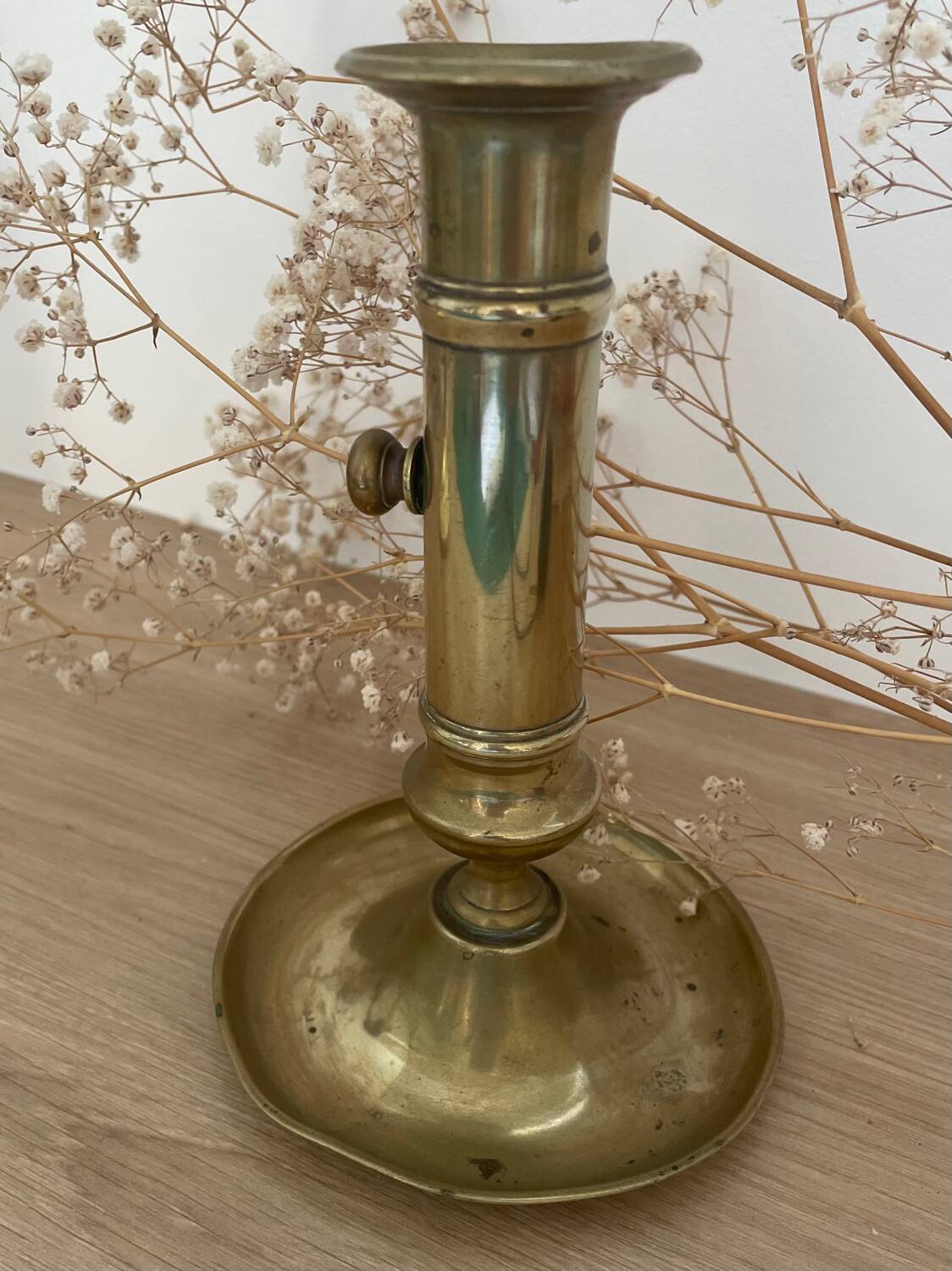 Brass candle holder with push button