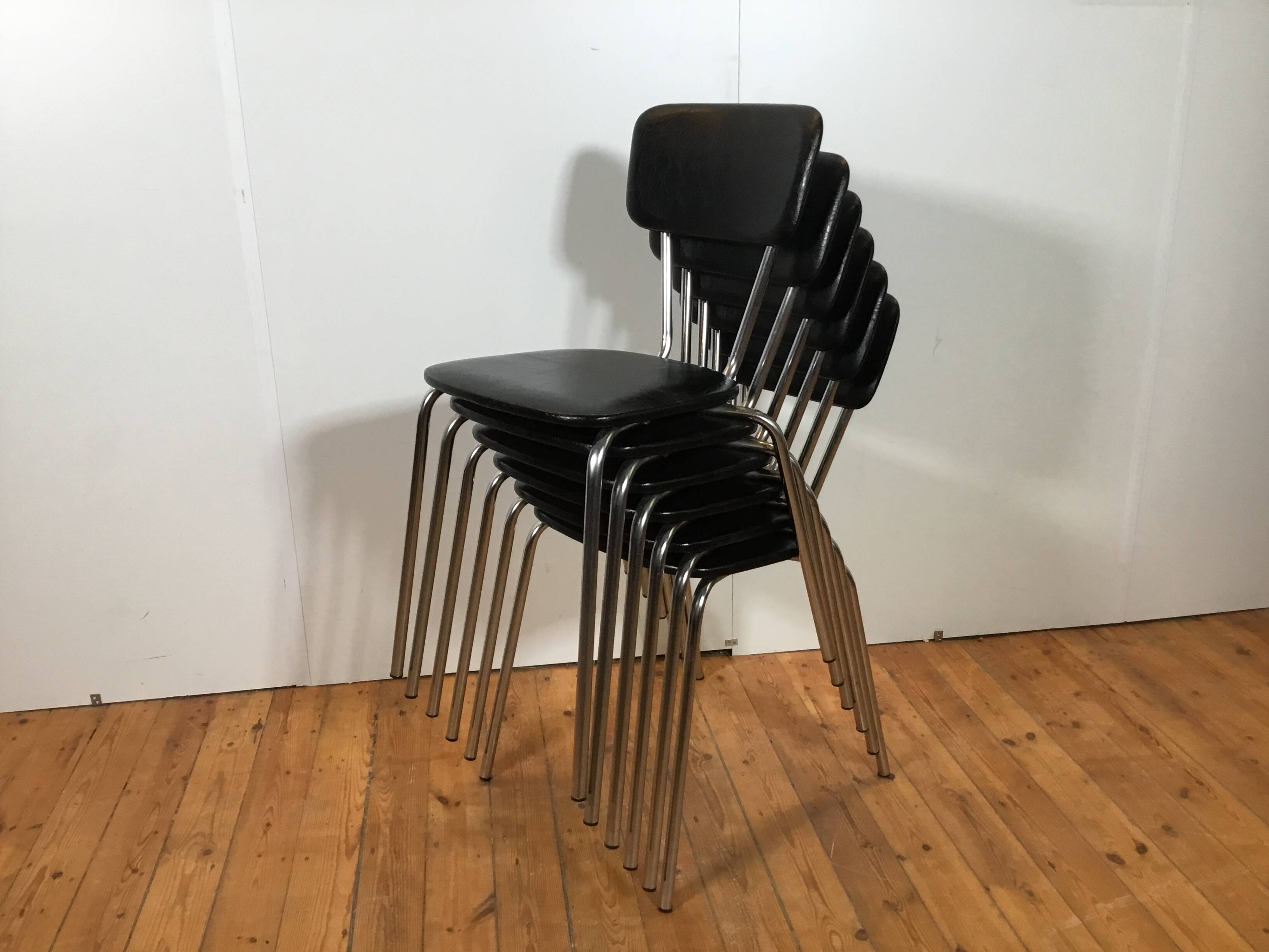 vintage chromed tubular steel stackable dining chairs