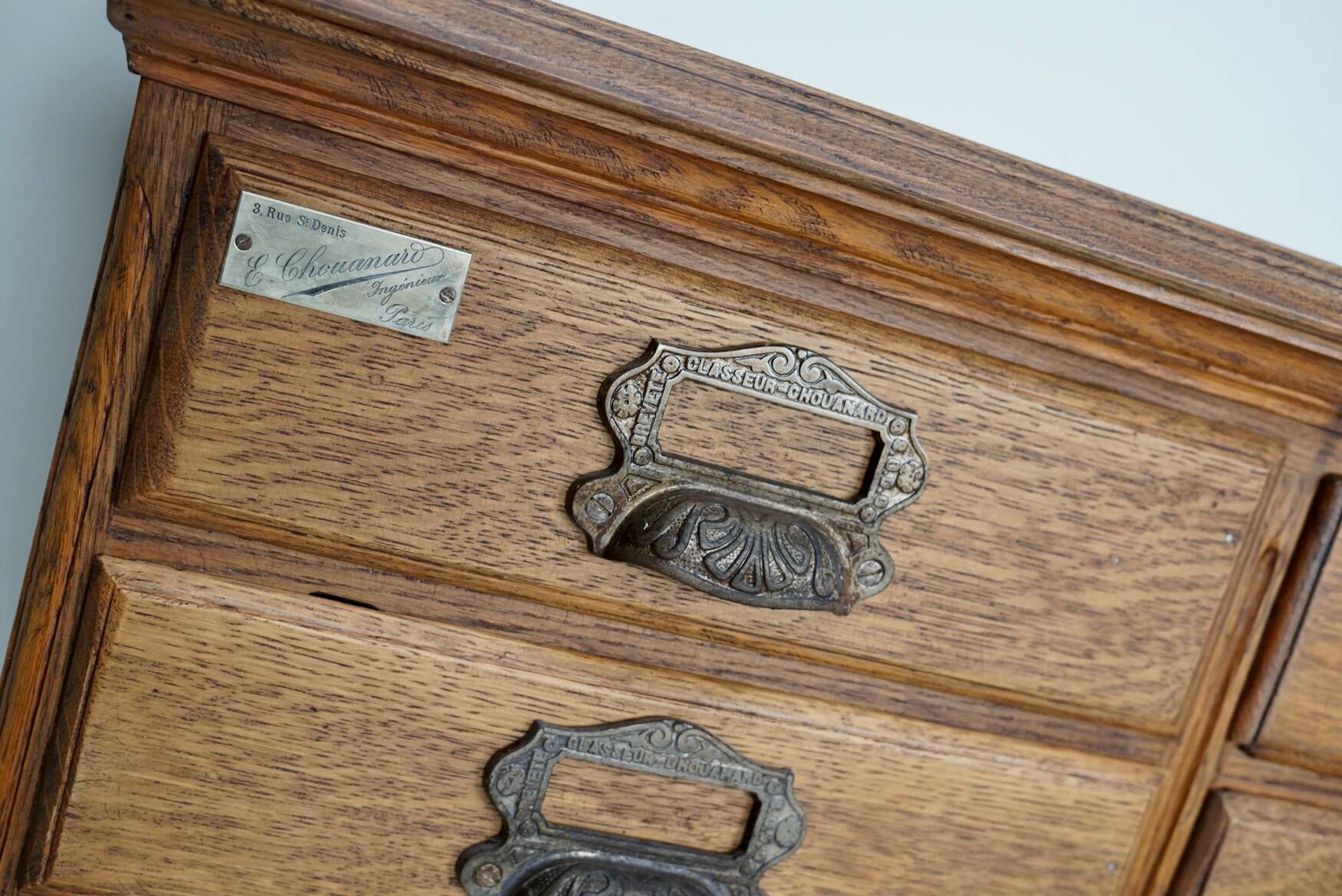 Antique French oak filing / apothecary cabinet by Chouanard, ca 1910