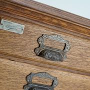 Antique French oak filing / apothecary cabinet by Chouanard, ca 1910