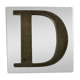 Metal letter D on glass plate