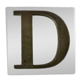 Metal letter D on glass plate