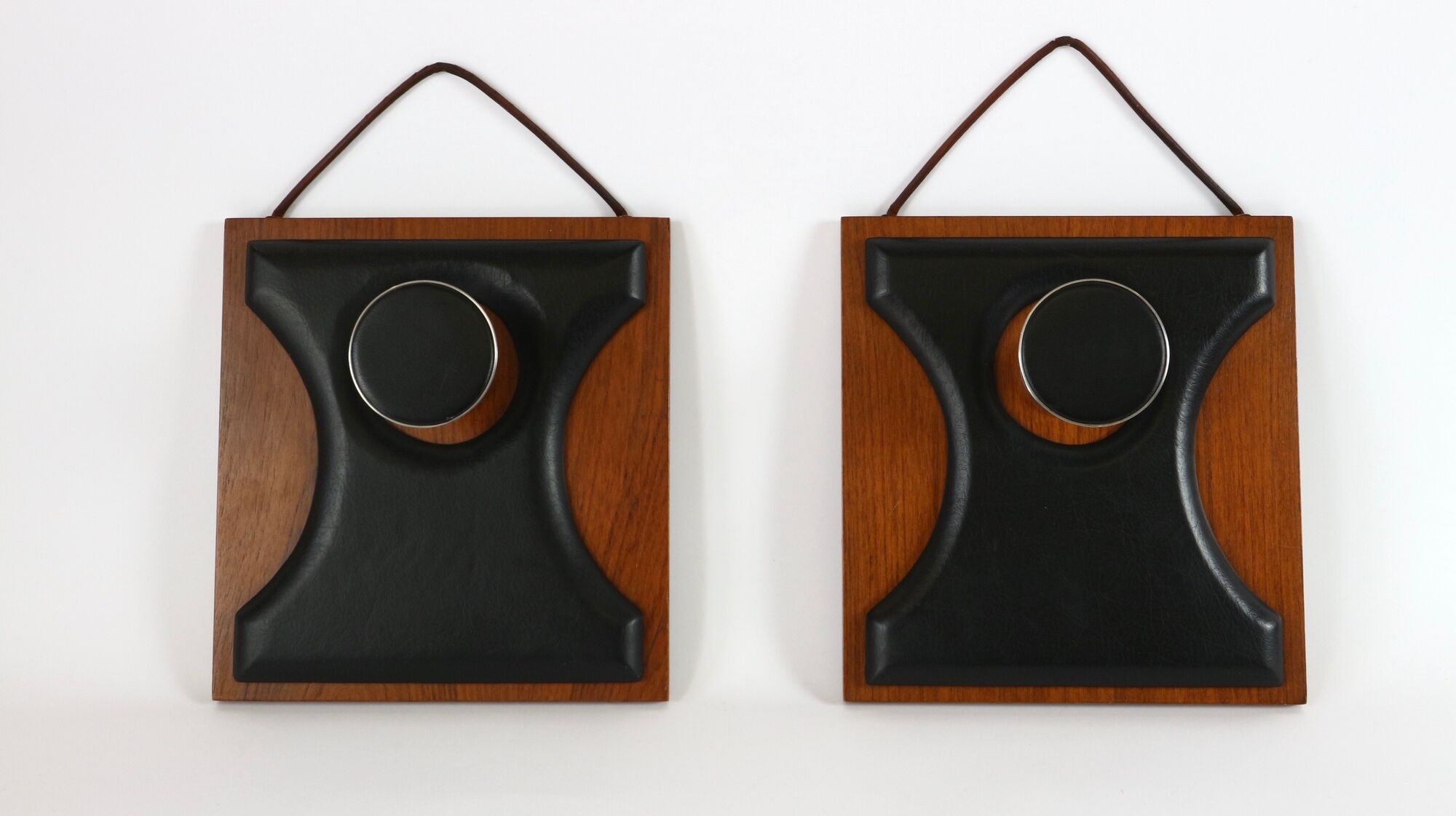 Two coat hangers, wood, leather and black leather, 70s