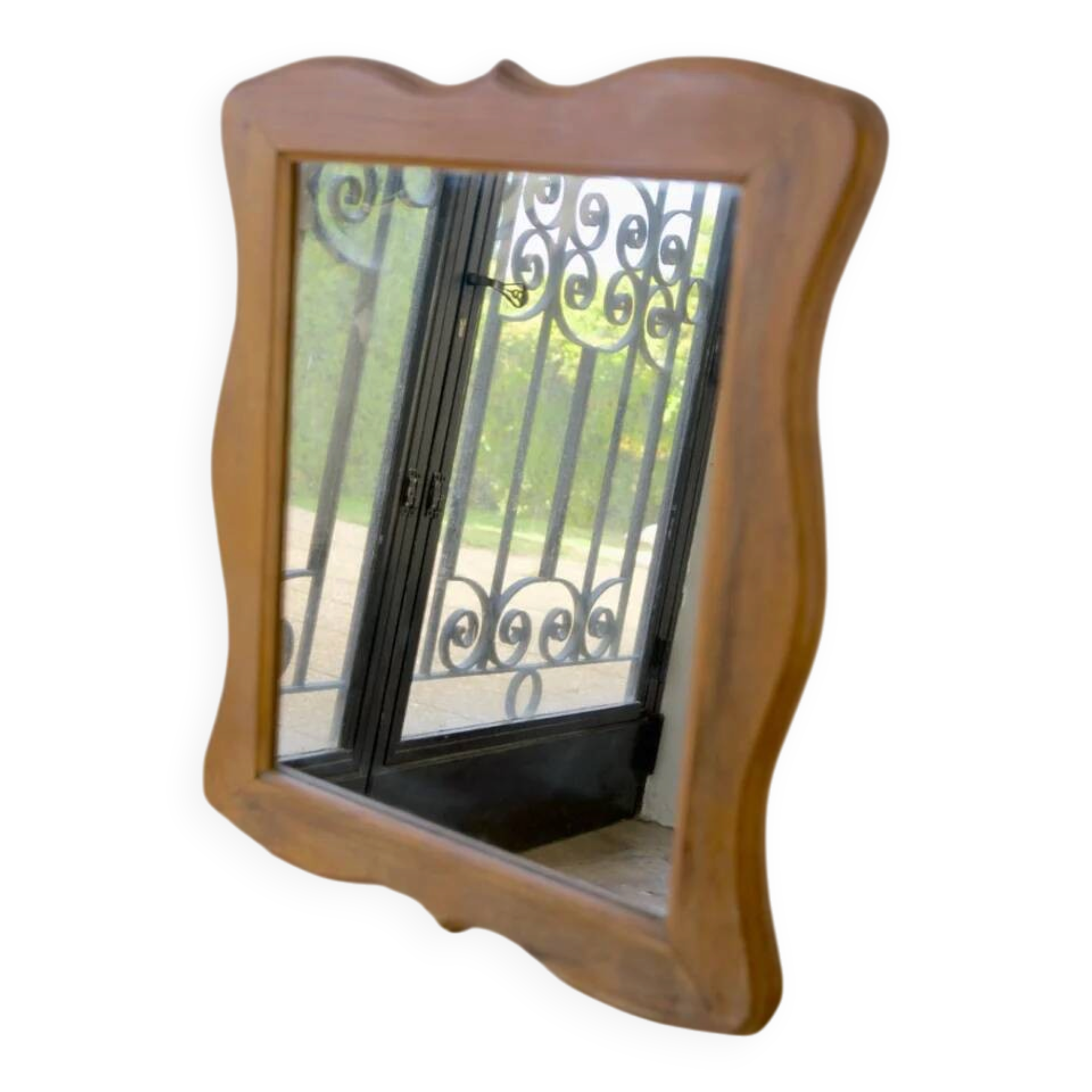 Wooden mirror with a shaped frame