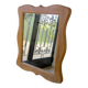 Wooden mirror with a shaped frame