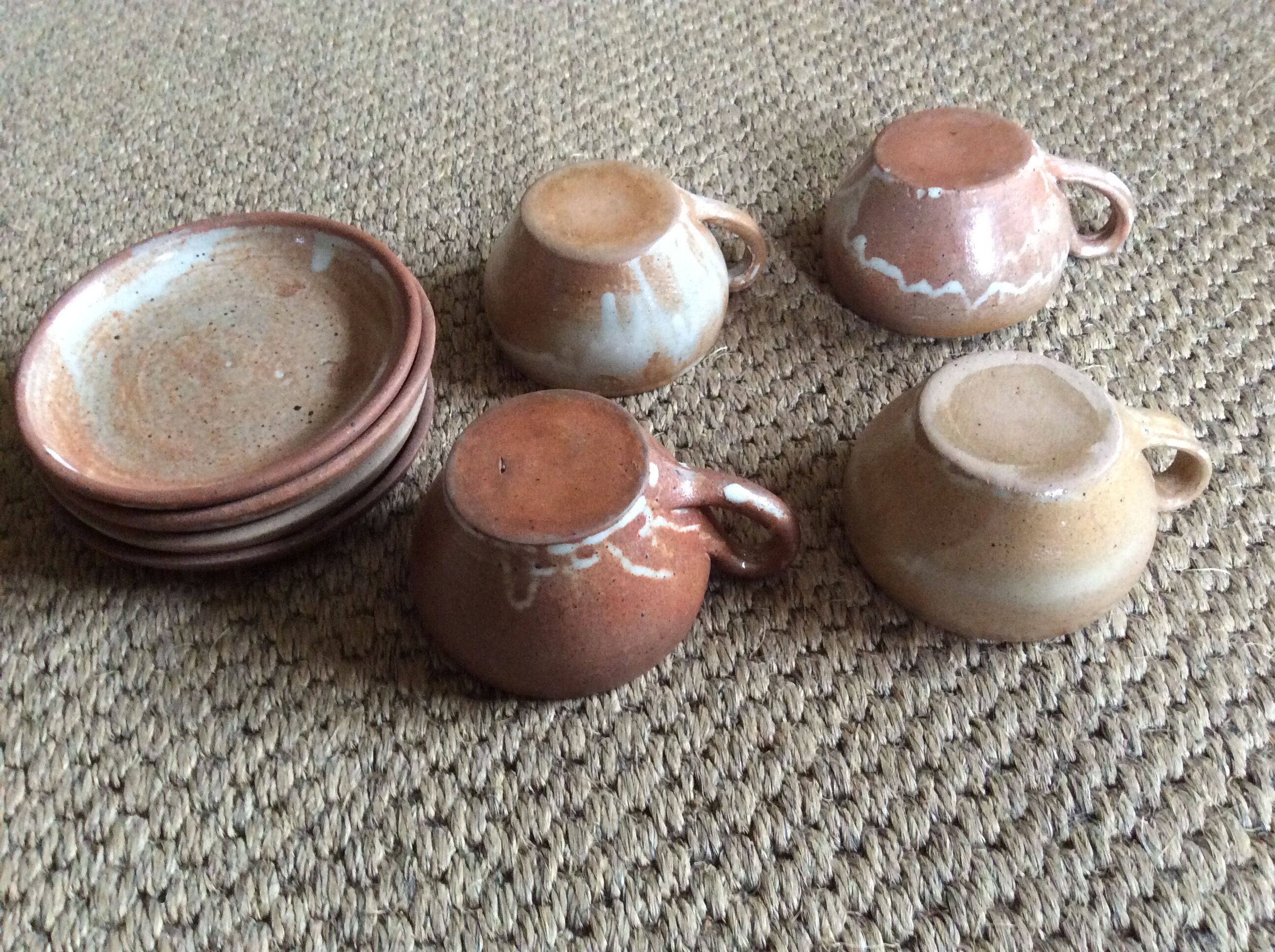 Series of 4 stoneware coffee cups