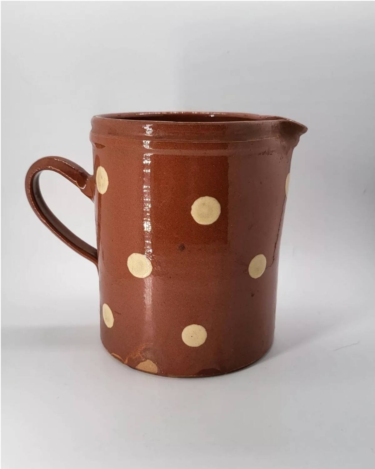 Old pitcher with polka dots savoyard pottery in glazed terracotta alsace