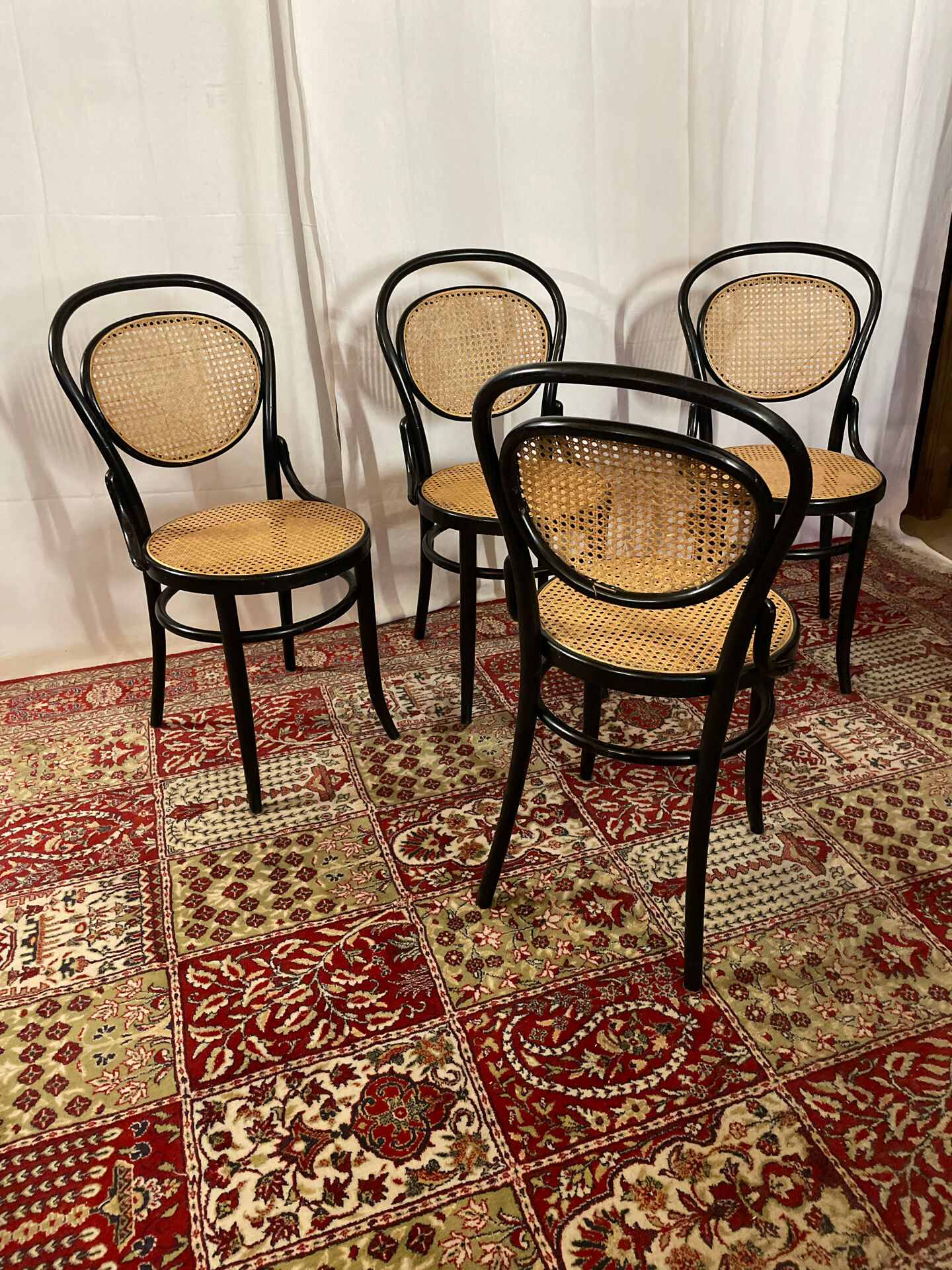 Set of 4 bentwood bistro chairs in black with caning.