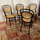 Set of 4 bentwood bistro chairs in black with caning.