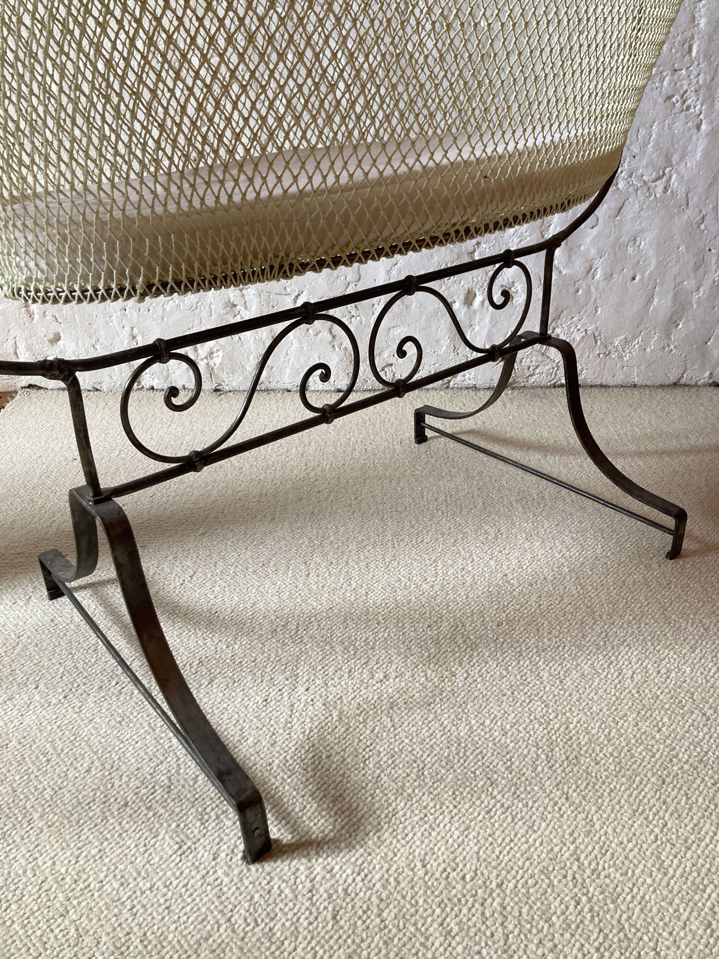 Antique rocking cradle in wrought iron