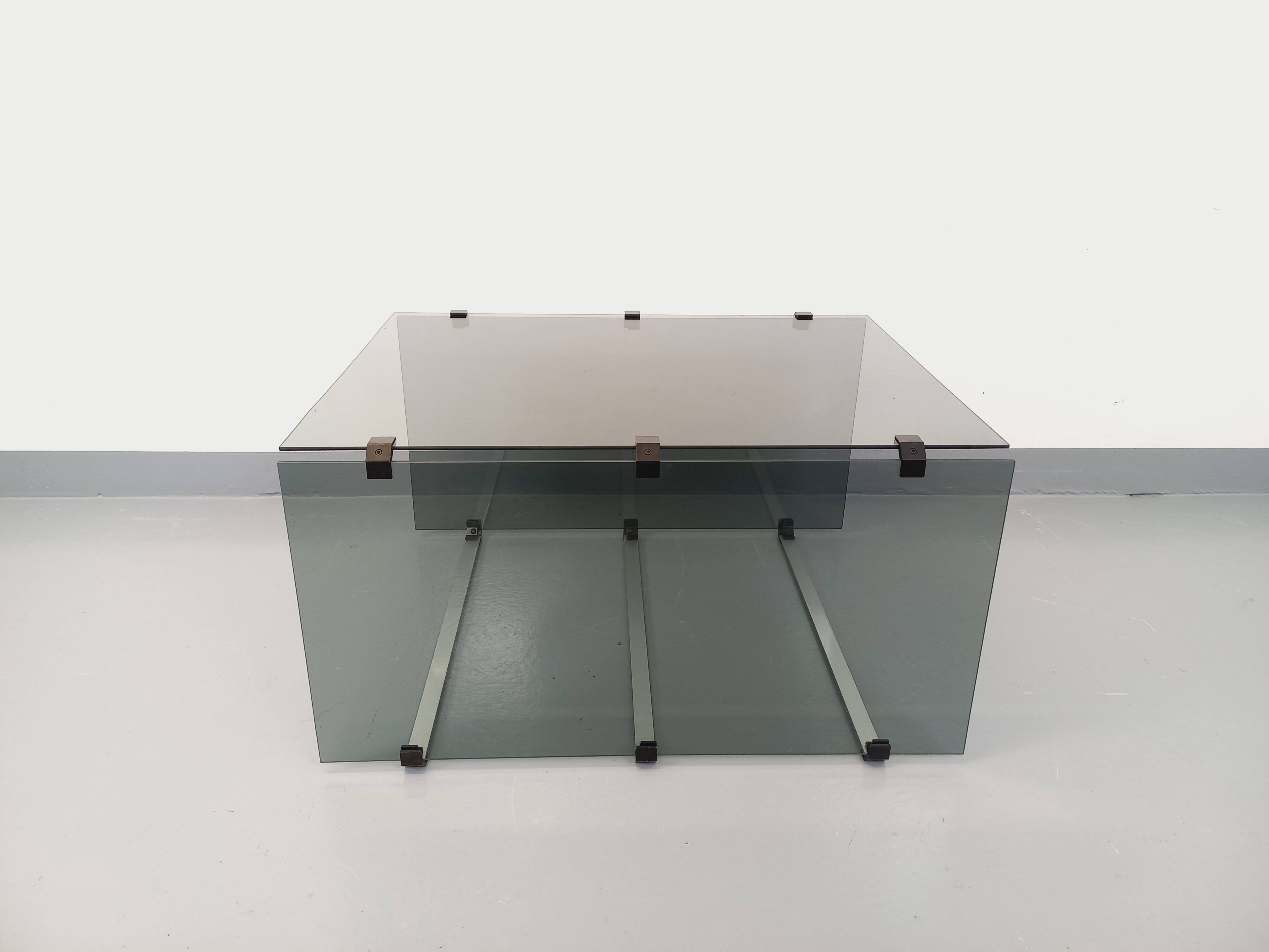 Vintage coffee table in smoked glass, black metal and cast aluminum