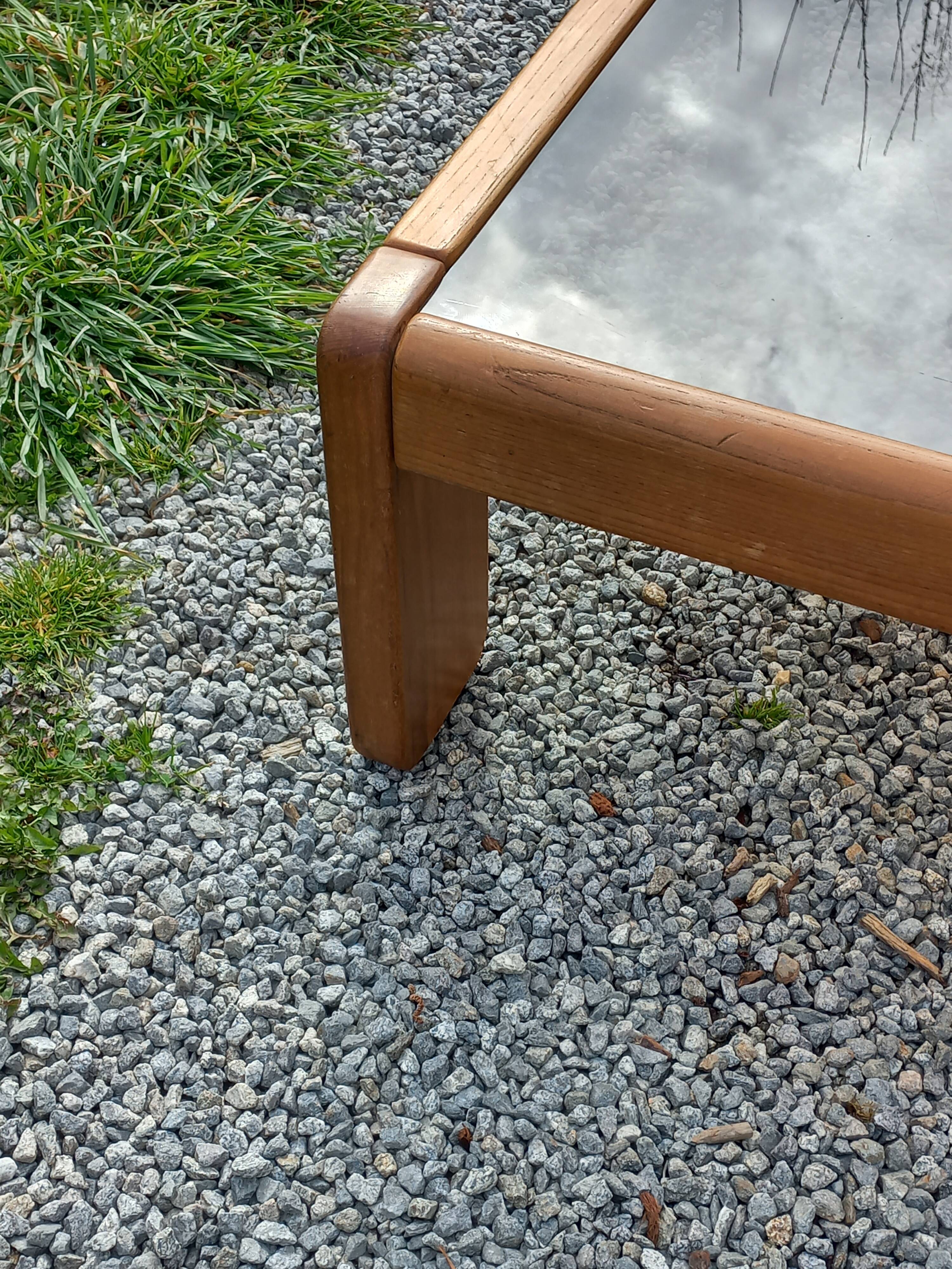 Coffee table from Regain in solid elm with a smoked glass top.