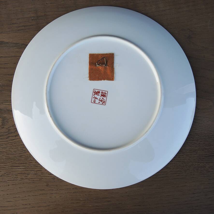 Antique Chinese ceramic plate with peacock decoration