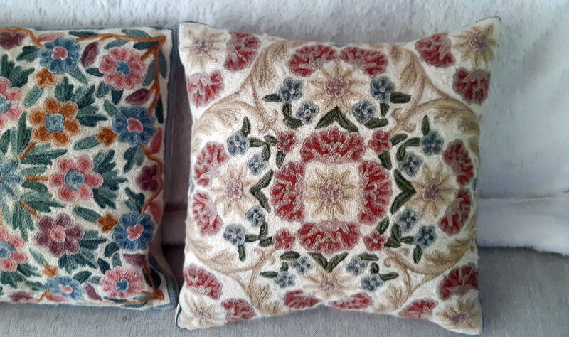 Set of three old hand-embroidered wool cushions