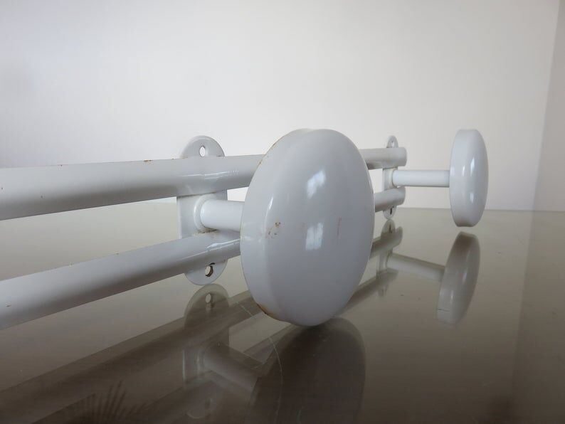 White metal coat holder in 70s