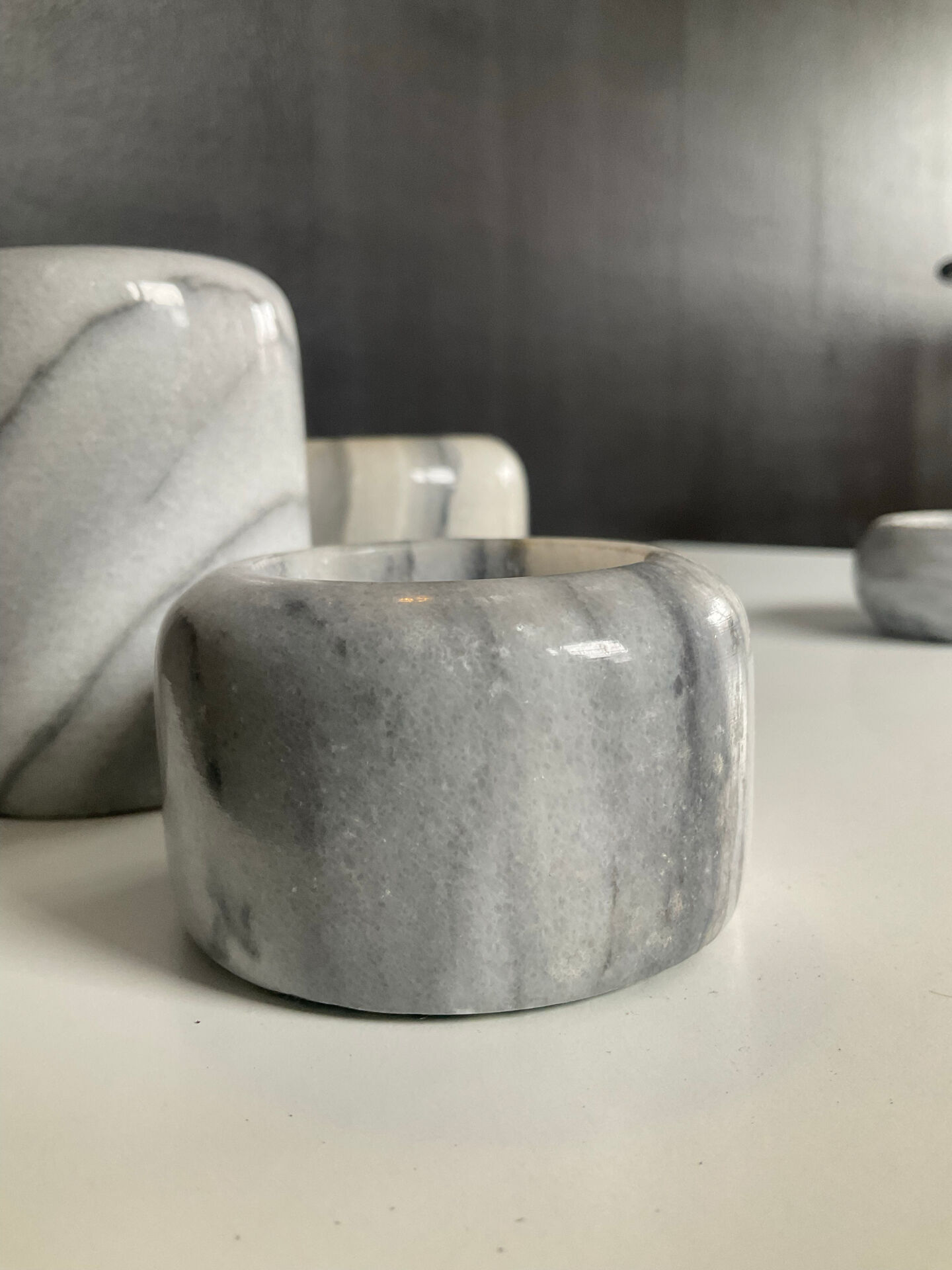 Set of 5 nesting candle holders in white marble.