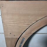Old arched window made of fir wood