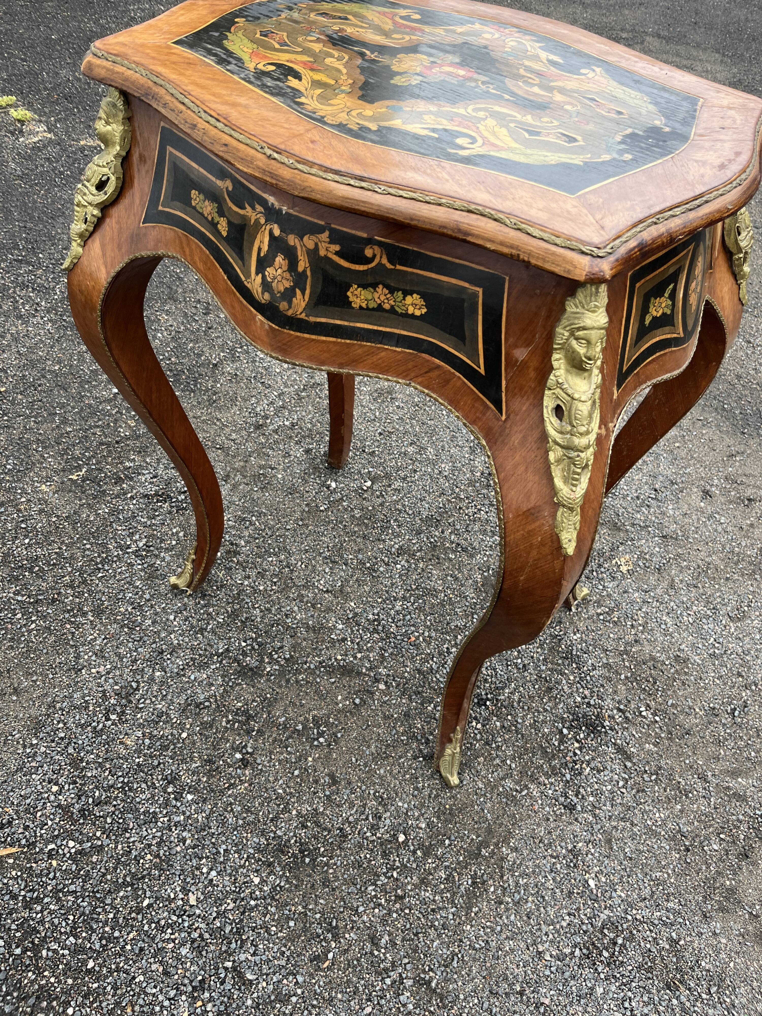 Louis XV style side table with marquetry and gilded bronze.