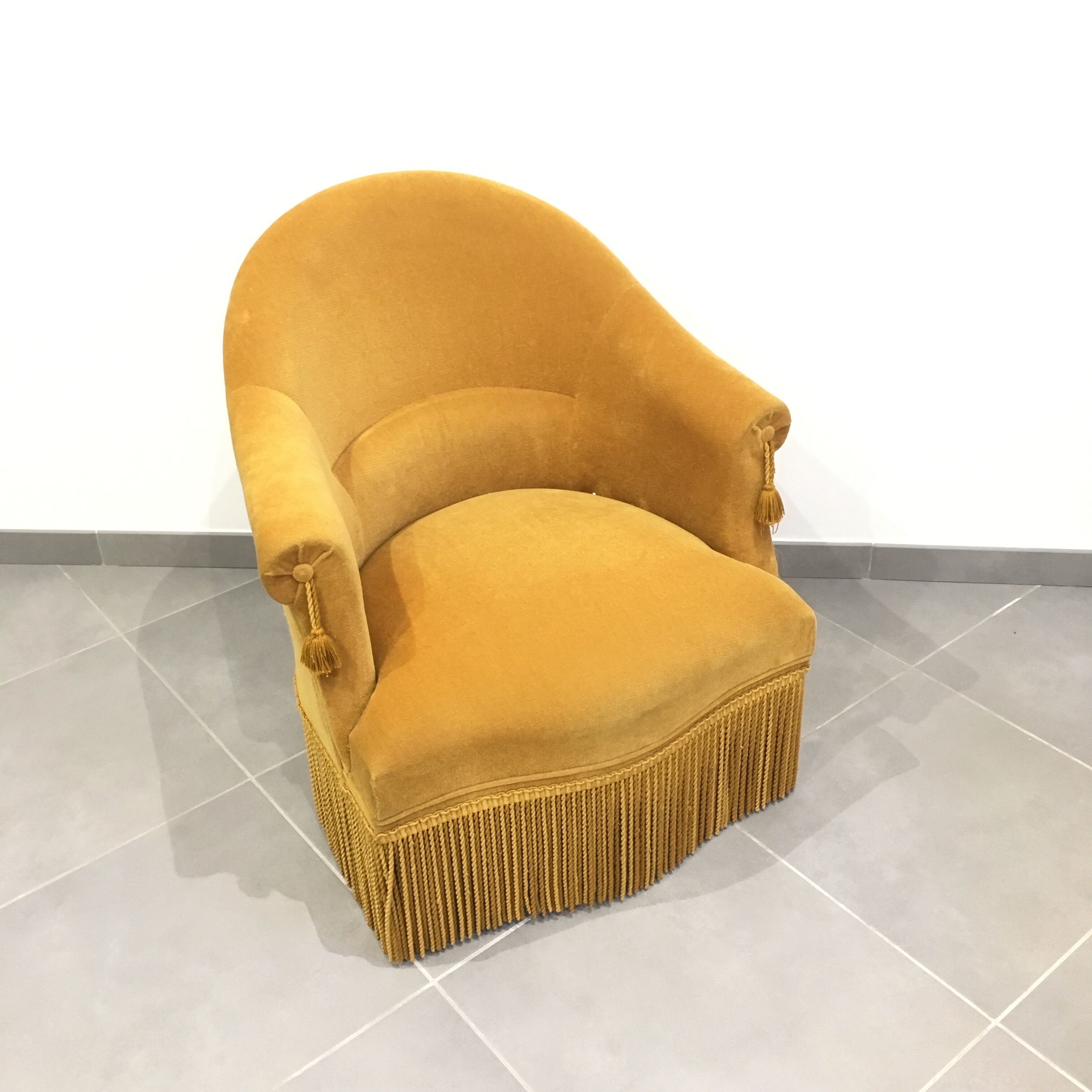 Pair of velvet fringed low chairs