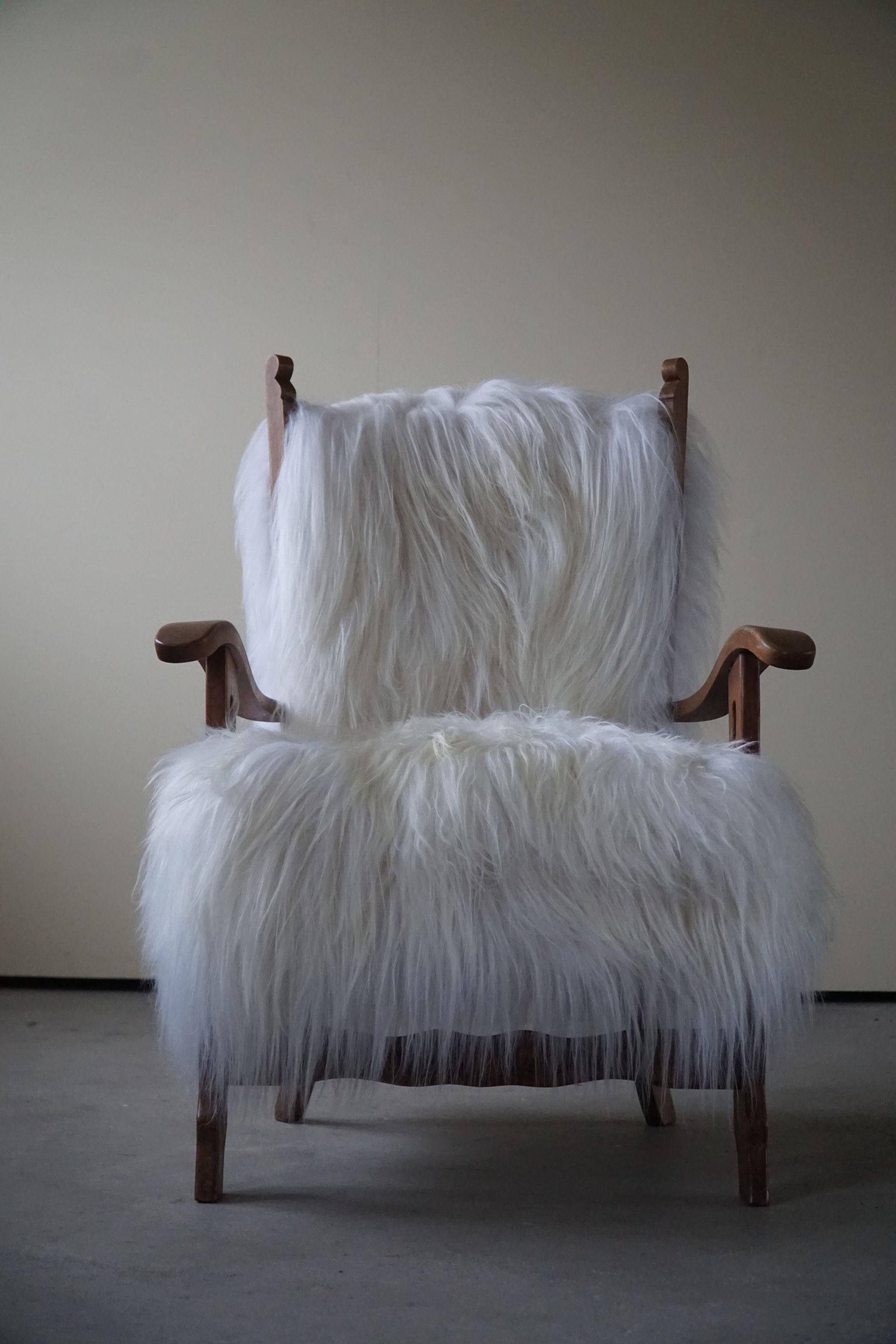 Henning Kjærnulf, armchair reupholstered in long-haired Icelandic sheepskin, 1950