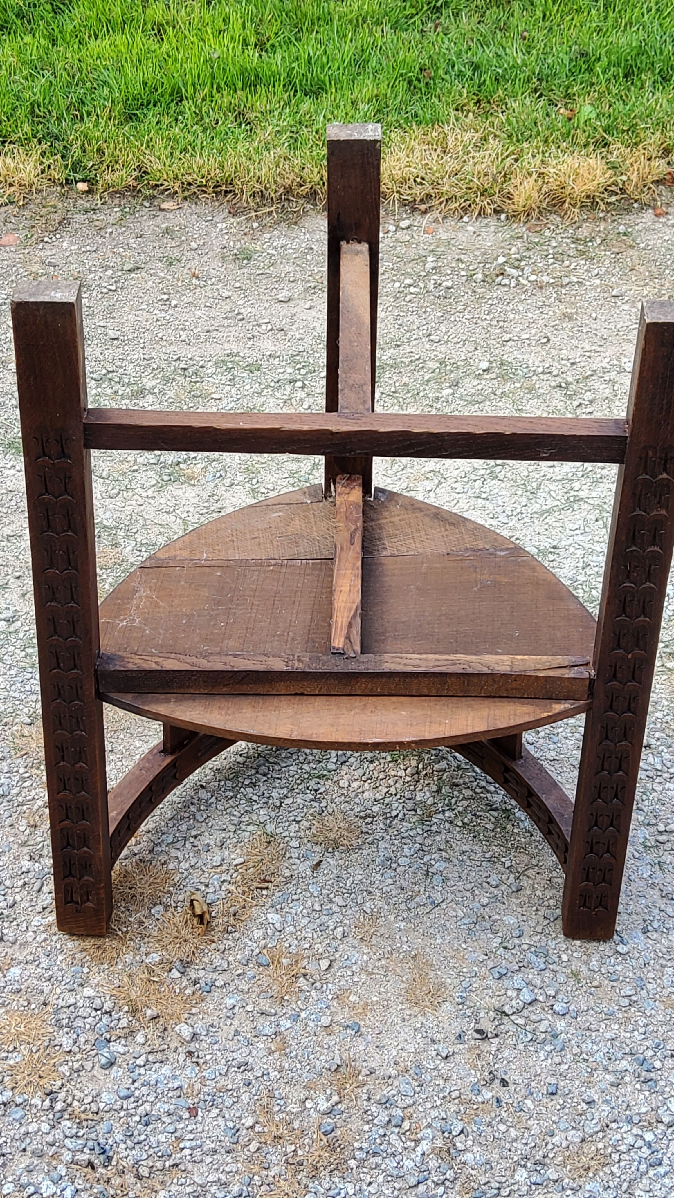 Set of three brutalist tripod armchairs in carved solid oak