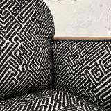 Club armchair in wood and fabric.