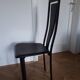 Set of 6 wooden chairs covered in leather.