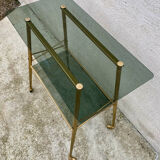 Vintage 1970s glass and gold rolling console table.