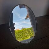 Vintage oval mirror on suspended stand