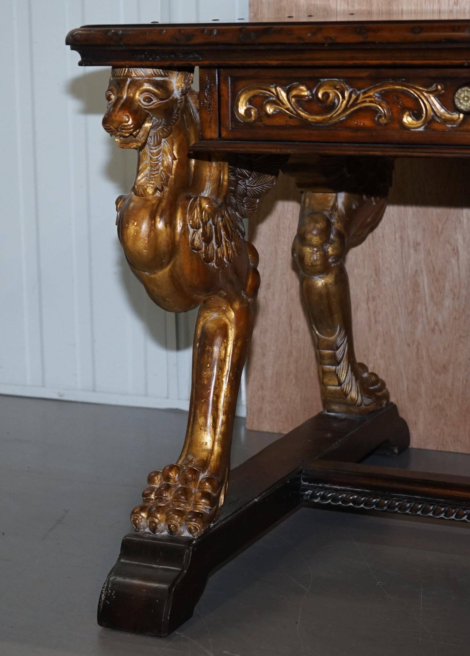 Double-sided writing desk in hardwood with gilt griffins, RJ Horner style.