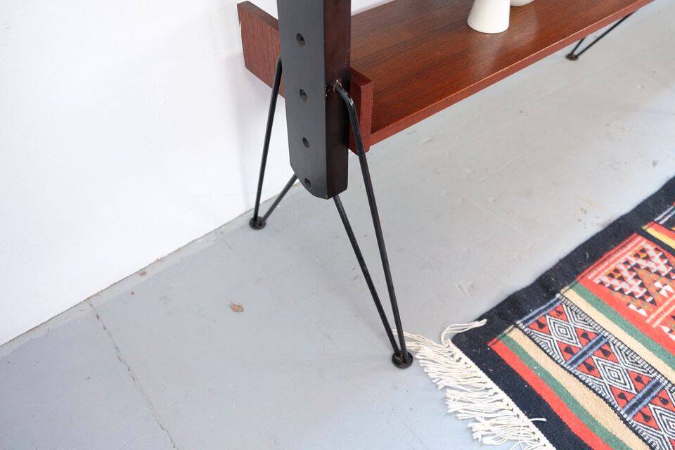 Vintage teak shelving system in 60s-70s style, retro style.