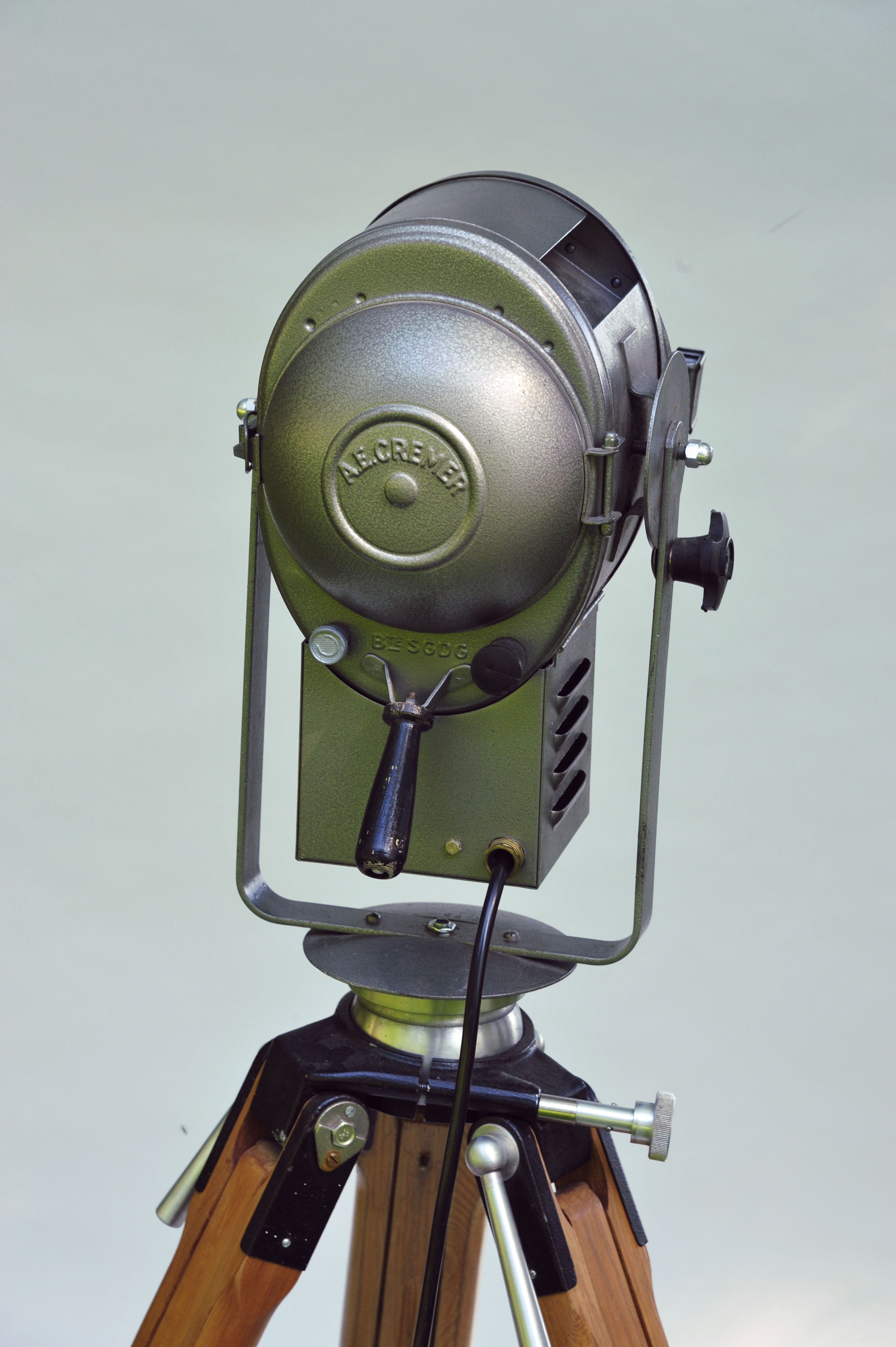 Cremer cinema projector on wooden tripod