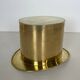 Champagne cooler shaped like a brass top hat.