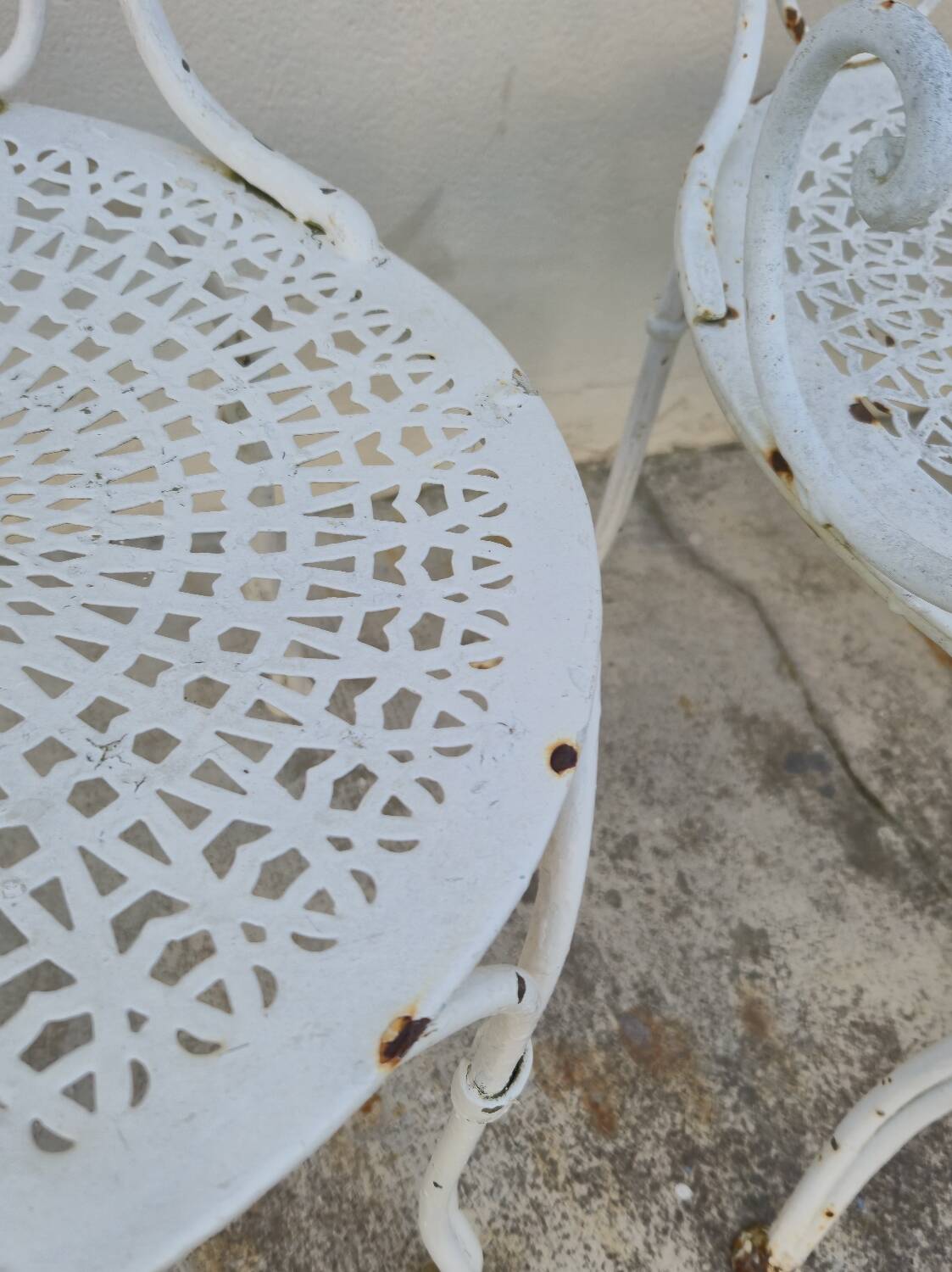 Garden furniture, two armchairs and two wrought iron chairs, period 1