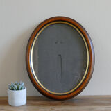 Oval wooden frame and gilded painted
