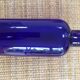 Large blue pharmaceutical vial