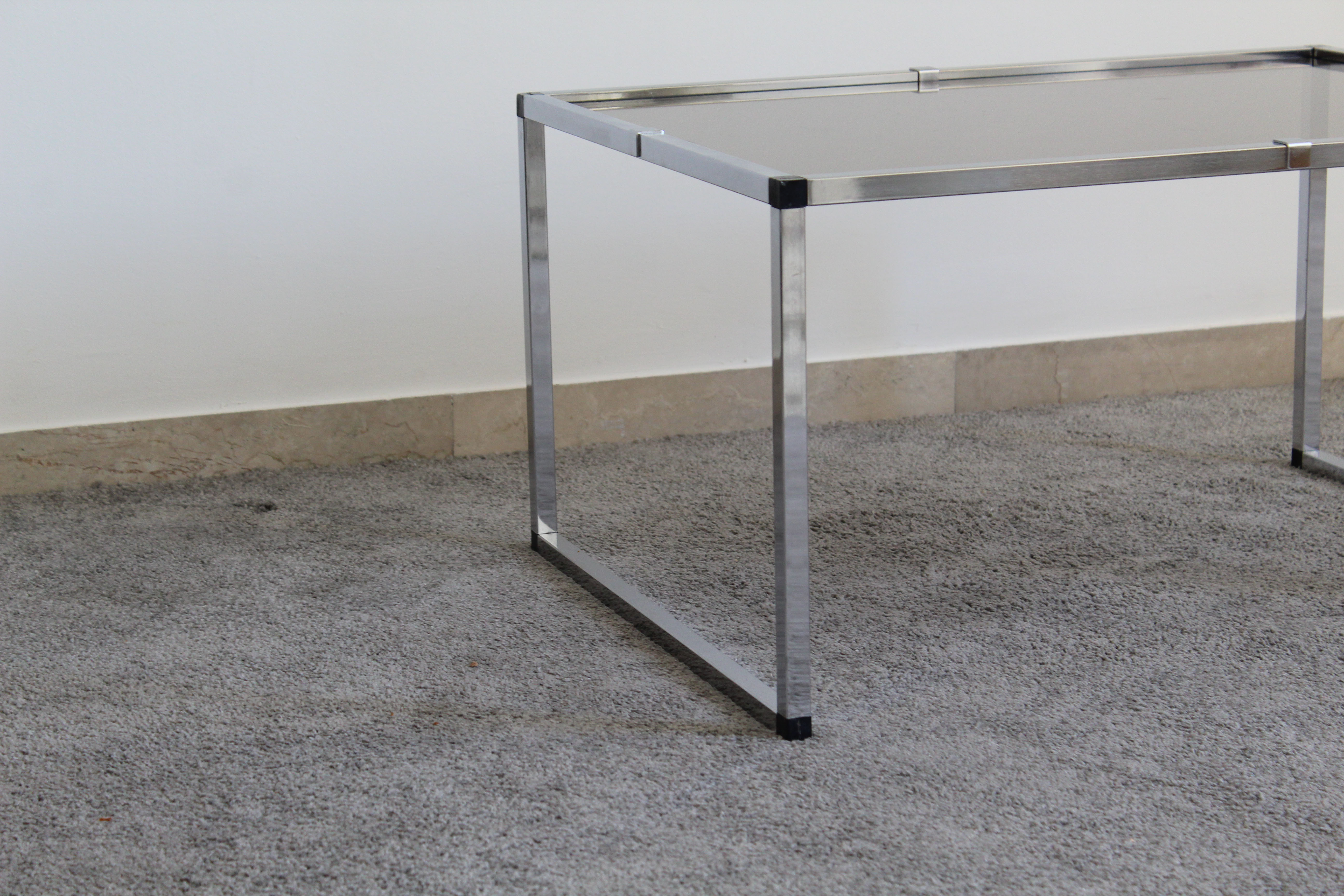 Pair of Coffee Tables in chromed metal and smoked glass, Italy 70's