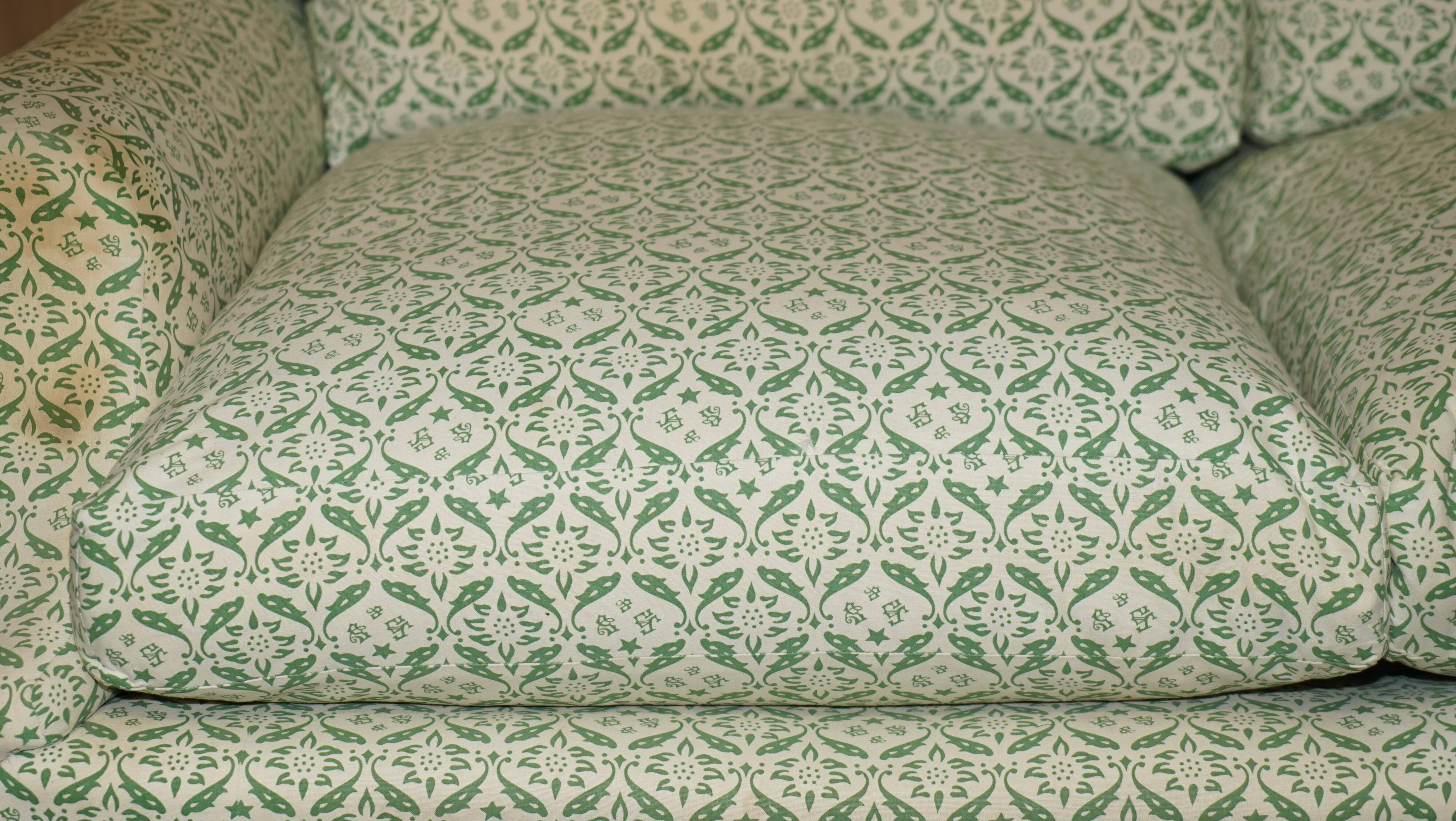 Howard & Son's Chairs Ltd ticking fabric canapé with feather cushions.