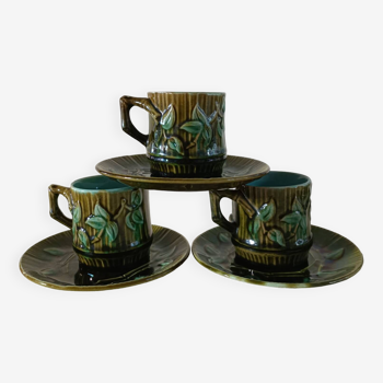 3 slip cups and saucers with bamboo decor