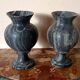Pair of black serpentine marble vase-urns, early 20th century, Empire style