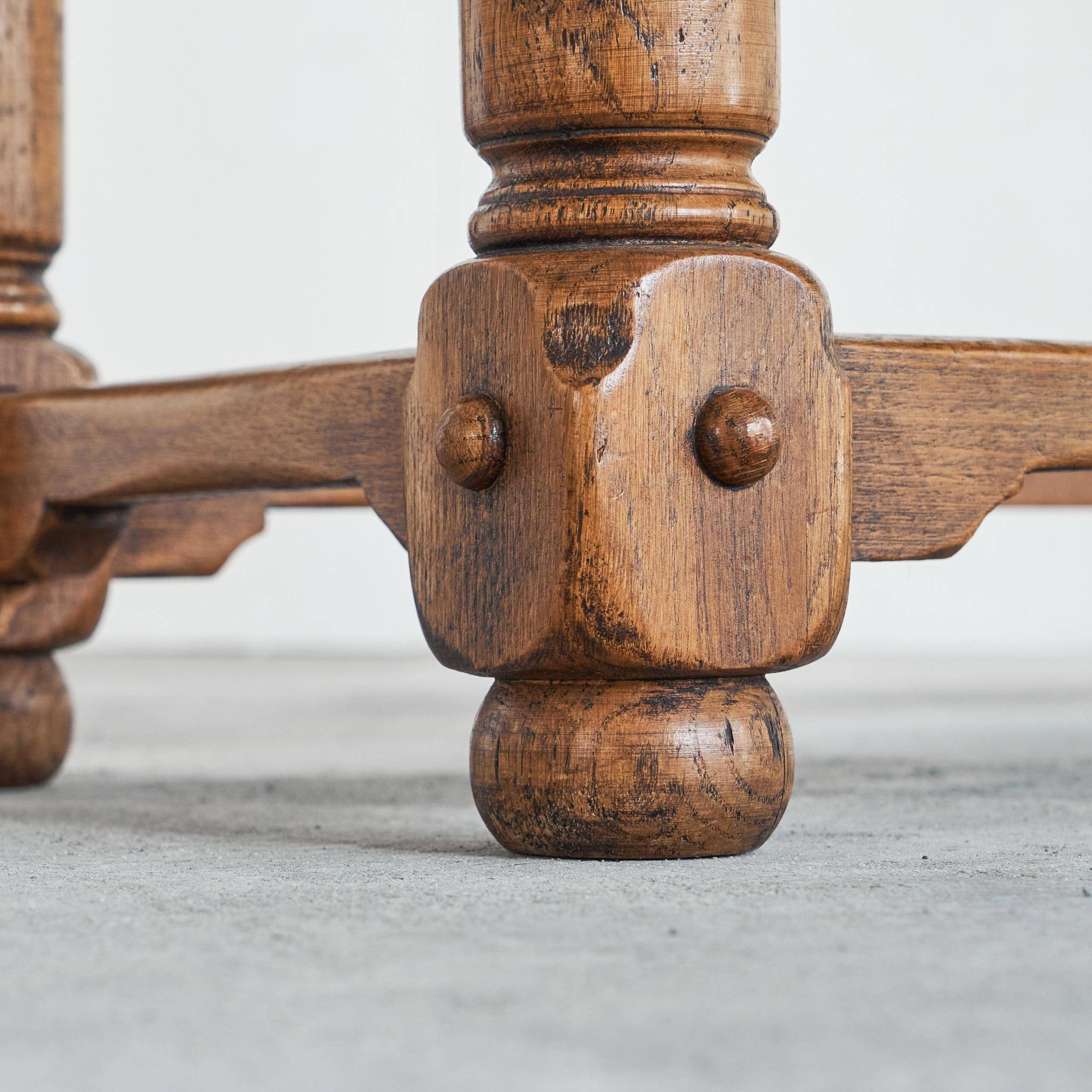 Brutalist coffee table in solid oak, metal, and patinated leather, 1940s.