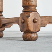 Brutalist coffee table in solid oak, metal, and patinated leather, 1940s.