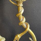 Old table lamp in bronze and brass gilded with satyr and snake
