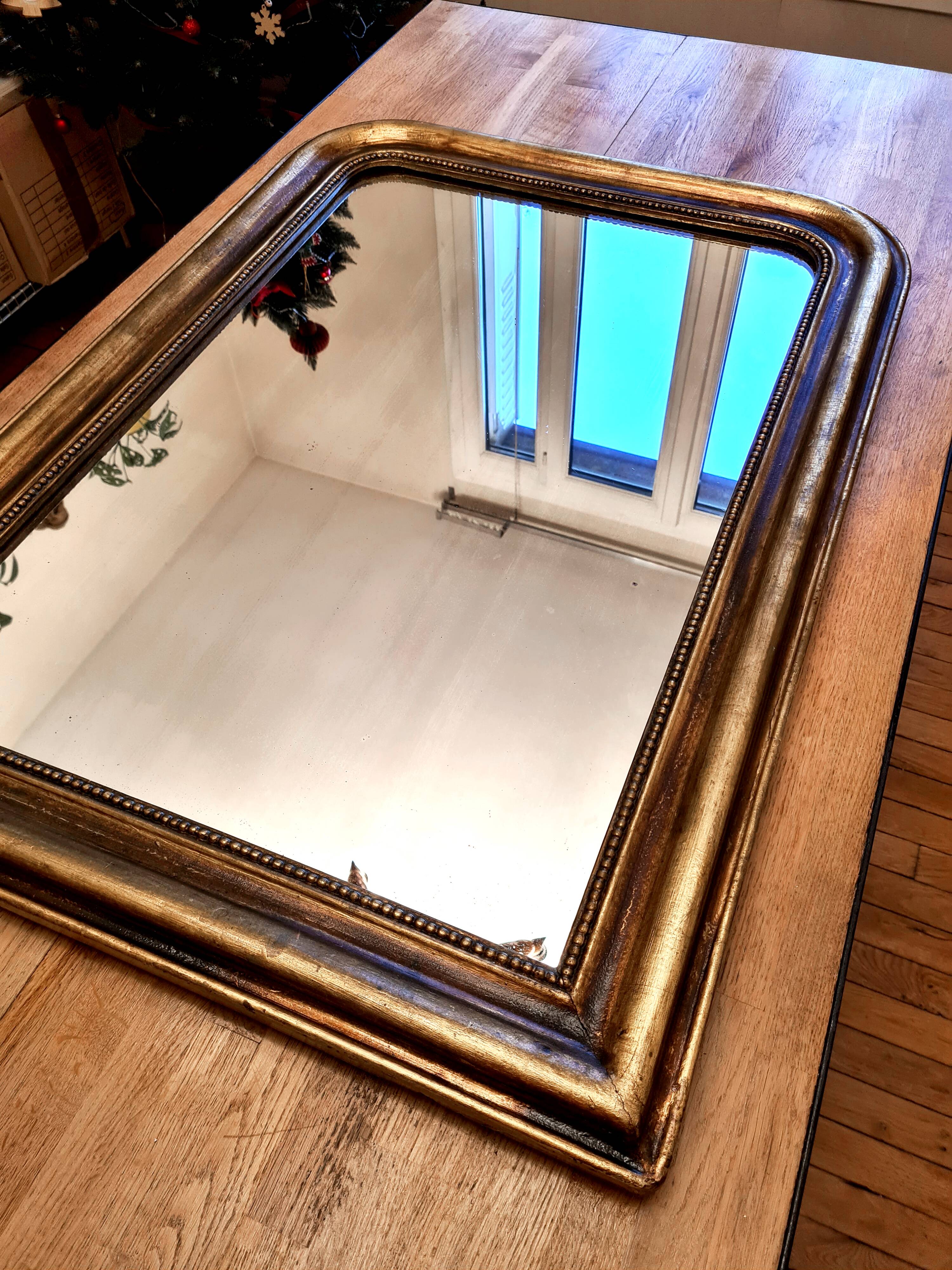 Antique Louis-Philippe gilded mirror “Apoline”