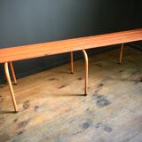 Old orange metal bench