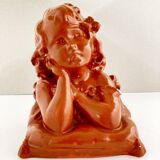 Bust of a pensive child in plaster