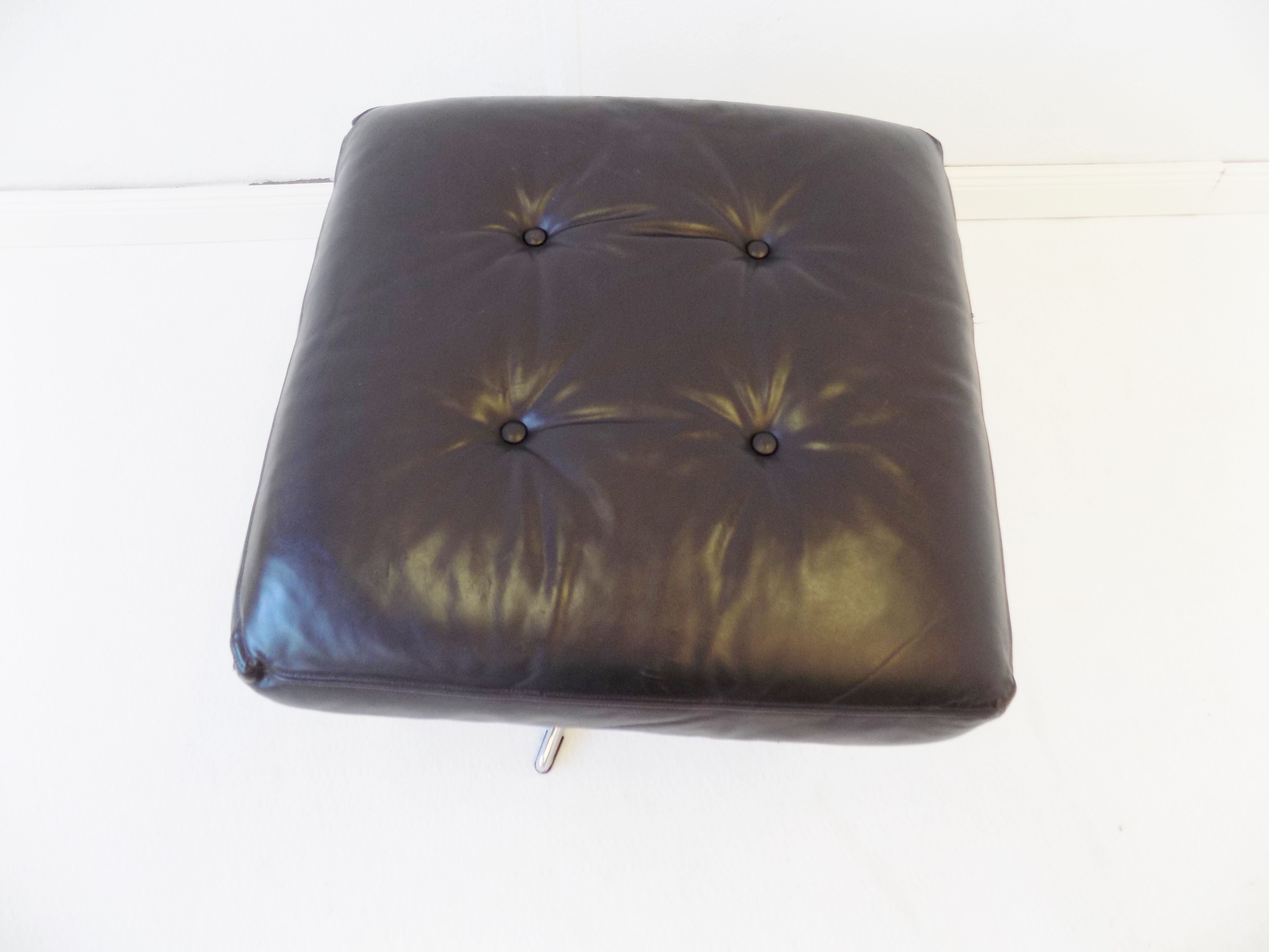 Danish black leather armchair with ottoman 70s