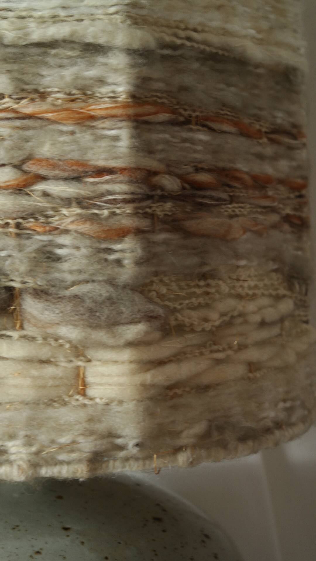 Vintage ceramic lamp with a wool shade.